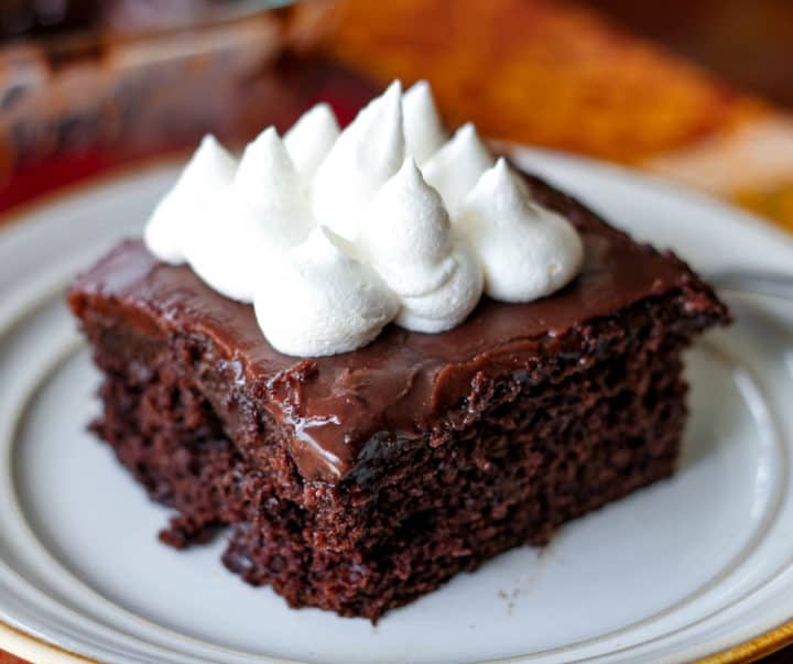 Sinful Triple Chocolate Fudge Poke Cake - The Baking ChocolaTess