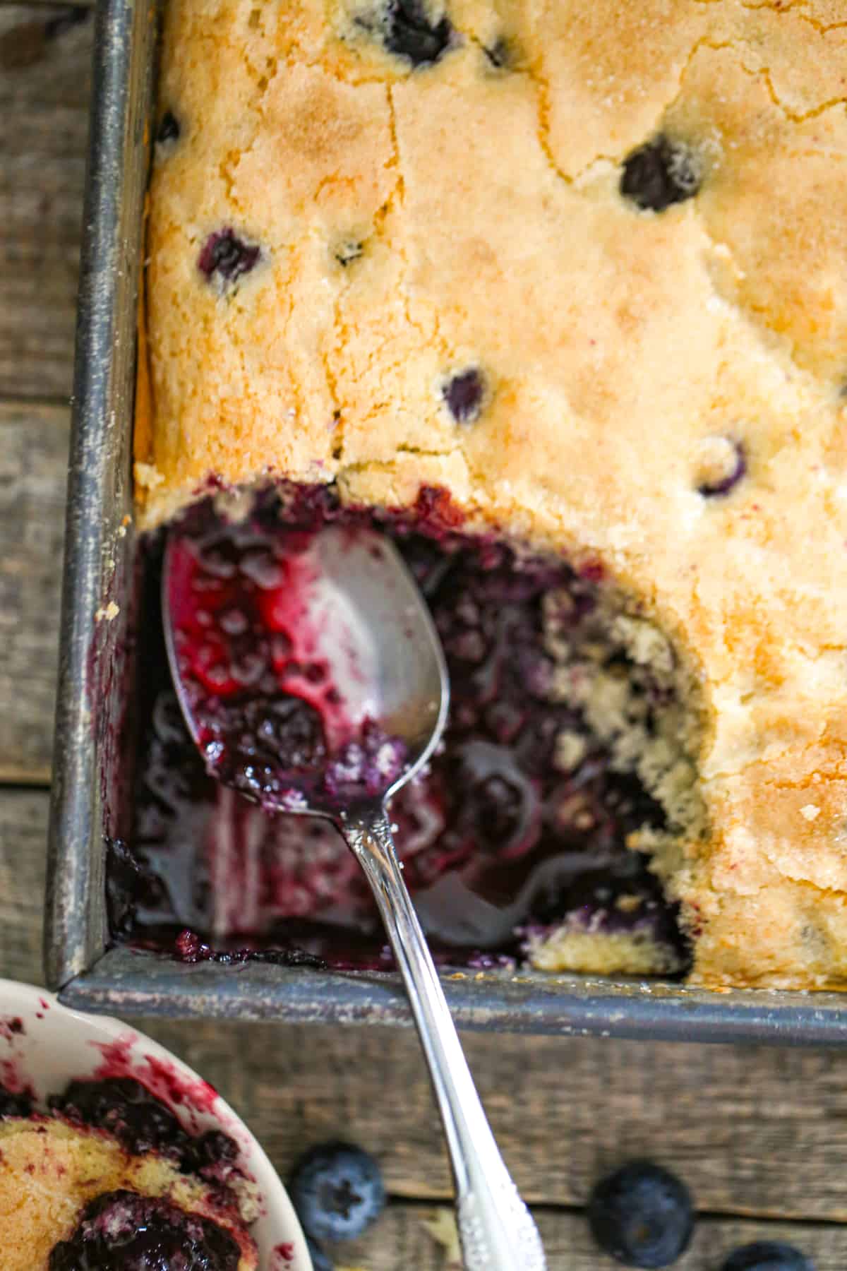 easy homemade blueberry cobbler recipe with warm buttery biscuit, cake-like crust and juicy blueberries filling