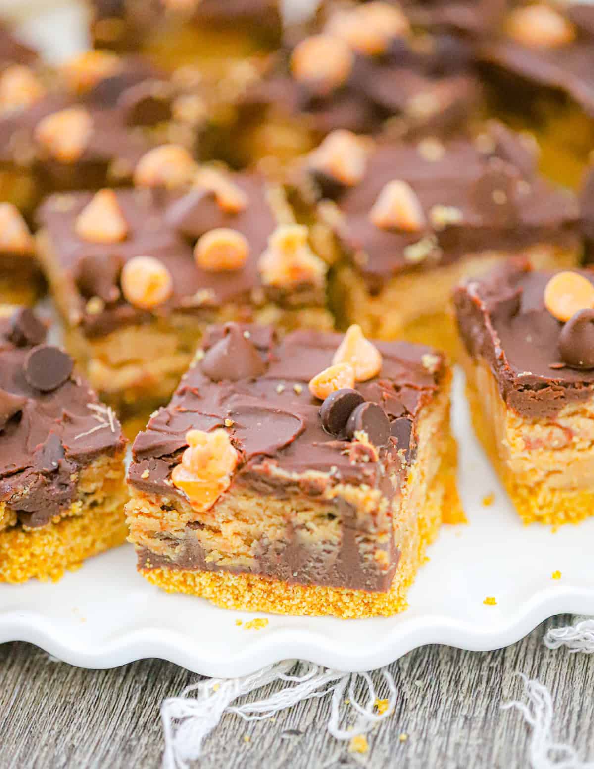 slices of no bake chocolate peanut butter cheesecake bars 