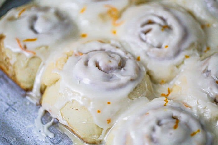 Easy Fluffy Orange Cream Iced Cinnamon Rolls recipe icing 