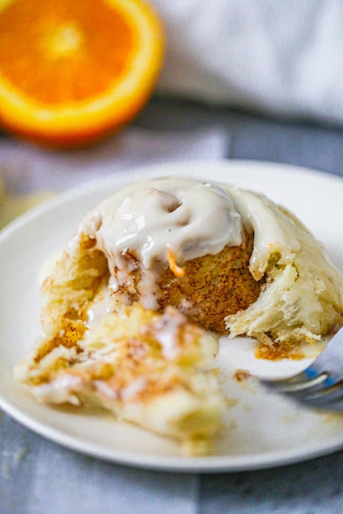 Easy Fluffy Orange Cream Iced Cinnamon Rolls recipe icing 