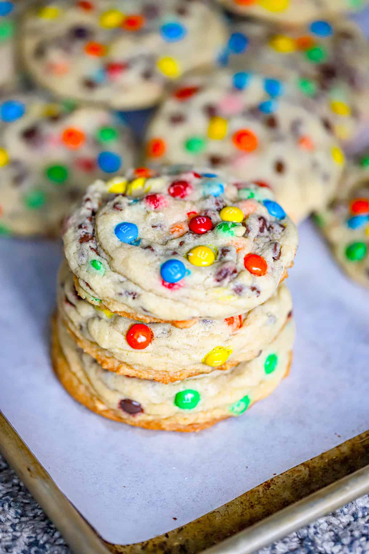 Our Ultimate Super Thick Mini M&M & Chocolate Chip Cookies recipe is one of the best gooey chewy & thickest bakery cookies with crispy edges!